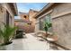 Outdoor patio featuring wicker chairs and a view of the surrounding desert landscape at 896 E Indian Wells Pl, Chandler, AZ 85249