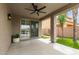 Covered patio with ceiling fan, travertine, and view of the backyard at 896 E Indian Wells Pl, Chandler, AZ 85249
