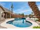 Inviting swimming pool with view of the canal and well-manicured landscaping at 896 E Indian Wells Pl, Chandler, AZ 85249