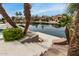 Beautiful waterfront view with lush landscaping and canal access at 896 E Indian Wells Pl, Chandler, AZ 85249