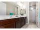 Spacious bathroom featuring double sinks and a shower over bath at 913 W Yosemite Dr, Chandler, AZ 85248
