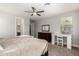 Comfortable bedroom with a ceiling fan, carpet, and a private desk area at 913 W Yosemite Dr, Chandler, AZ 85248