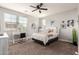 Cozy bedroom with neutral walls, a ceiling fan, and a vanity desk at 913 W Yosemite Dr, Chandler, AZ 85248