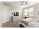 Cozy bedroom featuring carpeted floors, a ceiling fan, and a comfortable bed at 913 W Yosemite Dr, Chandler, AZ 85248