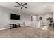 Large bonus room featuring a ceiling fan, carpet, and a staircase at 913 W Yosemite Dr, Chandler, AZ 85248