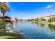 Picturesque community lake with waterfront homes, lush landscaping, and a tranquil fountain at 913 W Yosemite Dr, Chandler, AZ 85248