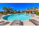 Resort-style community pool with lounge chairs, covered seating areas, and lush landscaping at 913 W Yosemite Dr, Chandler, AZ 85248