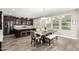 Open kitchen and dining area with island, pendant lighting, and modern appliances at 913 W Yosemite Dr, Chandler, AZ 85248