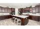 Gourmet kitchen with stainless steel appliances, granite counters, and custom cabinetry at 913 W Yosemite Dr, Chandler, AZ 85248