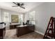 Spacious home office with large desk, ample natural light, and neutral carpeting at 913 W Yosemite Dr, Chandler, AZ 85248
