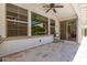 Covered patio with tiled flooring, ceiling fan, and large windows at 913 W Yosemite Dr, Chandler, AZ 85248