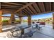 Community picnic pavilion with ample seating and stunning views of the lake and water feature at 913 W Yosemite Dr, Chandler, AZ 85248