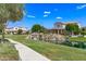 Scenic community with green spaces and a serene water feature cascading into a pond at 913 W Yosemite Dr, Chandler, AZ 85248
