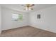Neutral bedroom featuring a window view and a ceiling fan for added comfort at 9265 N 111Th Ave, Sun City, AZ 85351