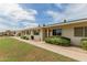 Beautifully maintained exterior with green shutters and mature landscaping at 9265 N 111Th Ave, Sun City, AZ 85351
