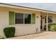 This house's exterior boasts green shutters, desert landscaping, and a welcoming facade at 9265 N 111Th Ave, Sun City, AZ 85351