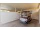 An attached garage showing a golf cart and ample parking in the driveway at 9265 N 111Th Ave, Sun City, AZ 85351