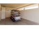 Attached garage showing a golf cart and ample parking in the driveway at 9265 N 111Th Ave, Sun City, AZ 85351