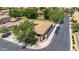 An elevated view of the home displays two parked cars, a tile roof, and lush yard at 948 E Savannah Dr, Chandler, AZ 85225