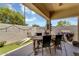 Comfortable covered patio area with outdoor dining and seating, perfect for entertaining guests at 948 E Savannah Dr, Chandler, AZ 85225