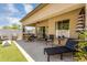 Covered back patio featuring ample seating and dining area, perfect for relaxing and entertaining at 948 E Savannah Dr, Chandler, AZ 85225