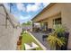 Inviting backyard with artificial turf, patio, and outdoor seating for entertaining at 948 E Savannah Dr, Chandler, AZ 85225