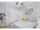 Bright bedroom with white furniture, closet space, and cute character decorations at 948 E Savannah Dr, Chandler, AZ 85225