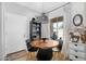 Cozy dining area with a round table, black chairs, unique light fixture, and stylish decor at 948 E Savannah Dr, Chandler, AZ 85225