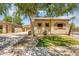 Charming single-story home with a tile roof, manicured lawn, and mature shade tree at 948 E Savannah Dr, Chandler, AZ 85225