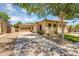 Inviting single-story home with a neutral color scheme, tile roof and desert landscaping at 948 E Savannah Dr, Chandler, AZ 85225