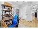 Bright home office with stylish shelving, modern furniture and a view to the hallway at 948 E Savannah Dr, Chandler, AZ 85225