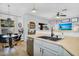 Bright kitchen features a stainless steel dishwasher, sink, and adjacent dining area with backyard view at 948 E Savannah Dr, Chandler, AZ 85225