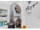 Functional laundry room equipped with modern appliances and convenient shelving at 948 E Savannah Dr, Chandler, AZ 85225