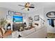 Bright living room with stylish decor, a ceiling fan, and modern lighting at 948 E Savannah Dr, Chandler, AZ 85225
