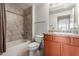 The bathroom has tile floors, a toilet, vanity, and bath tub at 9820 N Central Ave # 321, Phoenix, AZ 85020