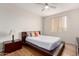 The bedroom has a large window for natural light and a ceiling fan at 9820 N Central Ave # 321, Phoenix, AZ 85020