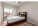 This bedroom has a sliding glass door to a balcony and a ceiling fan at 9820 N Central Ave # 321, Phoenix, AZ 85020