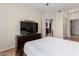 The bedroom has a dresser, tv, and is adjacent to the kitchen at 9820 N Central Ave # 321, Phoenix, AZ 85020