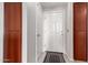 Condo entry has a white front door and built-in storage cabinets at 9820 N Central Ave # 321, Phoenix, AZ 85020