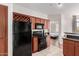 Bright kitchen with updated stainless steel appliances, cabinetry, and a wine rack at 9820 N Central Ave # 321, Phoenix, AZ 85020