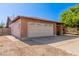 Charming single-story brick home with a two-car garage, long driveway, and low-maintenance landscaping at 10032 N 50Th Dr, Glendale, AZ 85302