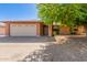 Charming single-story brick home with a two-car garage and a mature shade tree at 10032 N 50Th Dr, Glendale, AZ 85302