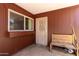 Covered porch with security door, bench and a large window at 10032 N 50Th Dr, Glendale, AZ 85302