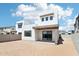 Modern home exterior with desert landscaping, covered patio, and contemporary design at 10253 E Ursula Ave, Mesa, AZ 85212