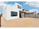 Modern home exterior with desert landscaping, covered patio, and contemporary design at 10253 E Ursula Ave, Mesa, AZ 85212