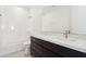 Bright bathroom features a modern vanity, full tub, and tiled floors at 10253 E Ursula Ave, Mesa, AZ 85212
