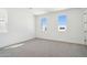 Bright bedroom with neutral walls, carpet, and natural light from multiple windows at 10253 E Ursula Ave, Mesa, AZ 85212