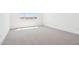 Bright, carpeted bedroom with a window allowing ample natural light at 10253 E Ursula Ave, Mesa, AZ 85212
