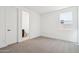 Light-filled bedroom with neutral carpet and access to an en-suite bathroom at 10253 E Ursula Ave, Mesa, AZ 85212
