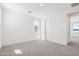 Bright bedroom with neutral walls, carpet, and natural light from multiple windows at 10253 E Ursula Ave, Mesa, AZ 85212